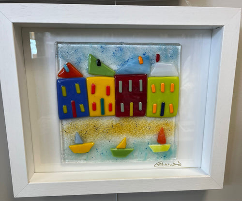 Fused glass piece, framed in white box frame.