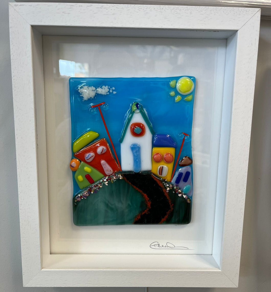 Fused glass piece, framed in white box frame.